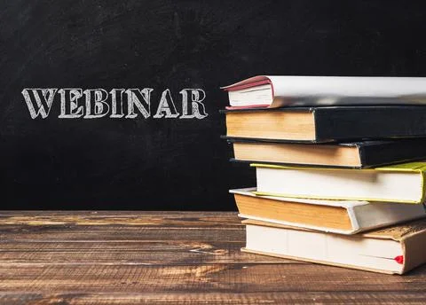 A stack of books with the word webinar written on top Stock Photos