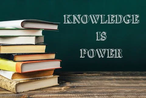 A stack of books with the words knowledge is power written on top Stock Photos