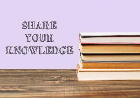 Stack of books with the words share your knowledge written on top Stock Photos
