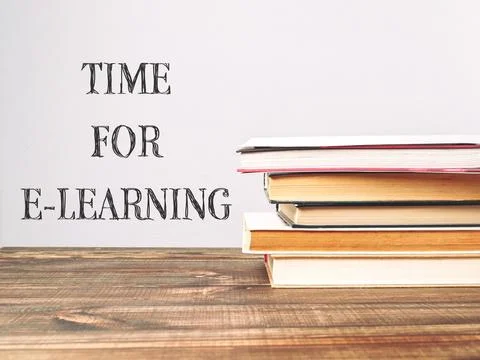 A stack of books with the words Time for e-learning written on top 스톡 사진