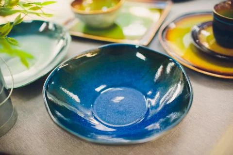 Stack of bowls in various shapes. Many colorful Sell at the market. Stock Photos