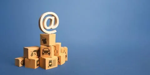 Stack of boxes and email internet symbol. Online Internet distribution of g.. Stock Photos