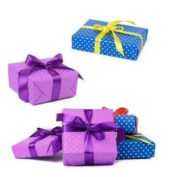 A stack of boxes wrapped in paper and tied with a silk ribbon on a white back 写真素材