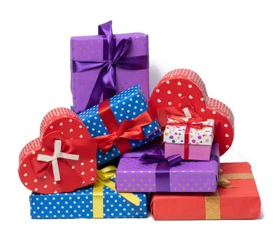 Stack of boxes wrapped in paper and tied with a silk ribbon on a white backgr 스톡 사진