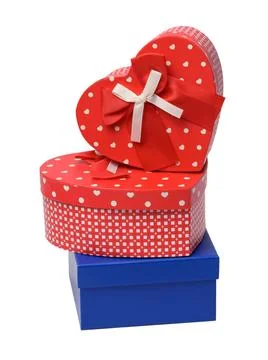 Stack of boxes wrapped in paper and tied with a silk ribbon on a white bac... 스톡 사진