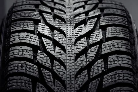 Stack of brand new high performance car tires on clean high-key white studi.. Фото