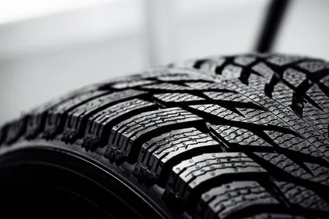Stack of brand new high performance car tires on clean high-key white studi.. Фото