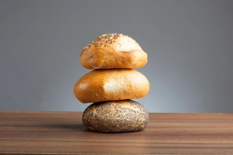 Stack of bread rolls on table Stock Photos