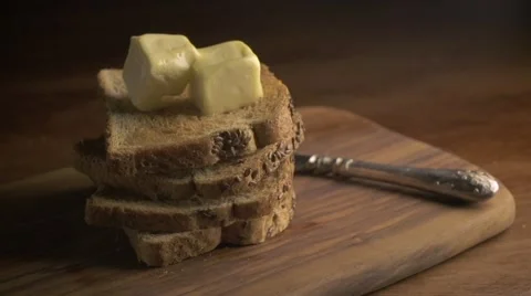 Stack of bread slices and melting butter Stock Footage 57320995