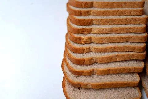 Stack of bread slices isolated on white. Stock Photos