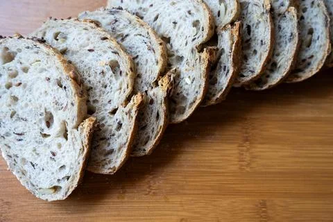 Stack of bread slices on wooden background 写真素材