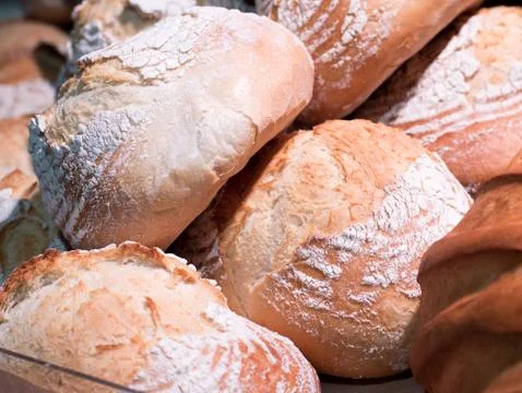 Stack of breads in parketplase. Fruits on store Фото