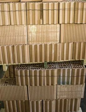 Stack of bricks in construction factory, industrial architecture Stock Photos