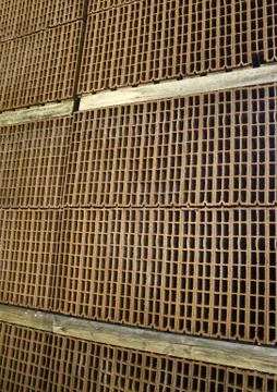 Stack of bricks in construction factory, industrial architecture Stock Photos
