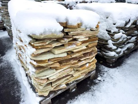 A stack of bricks covered in snow Foto stock