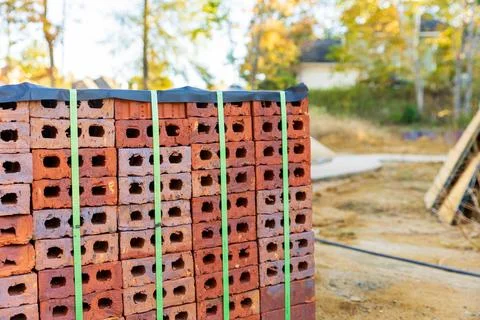 Stack of bricks for home construction with copy space Stock Photos