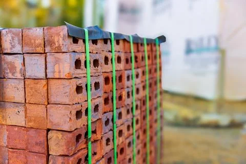 Stack of bricks for home construction with copy space Stock Photos