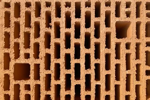 A stack of bricks made of red light clay. Environmentally friendly building m Foto stock