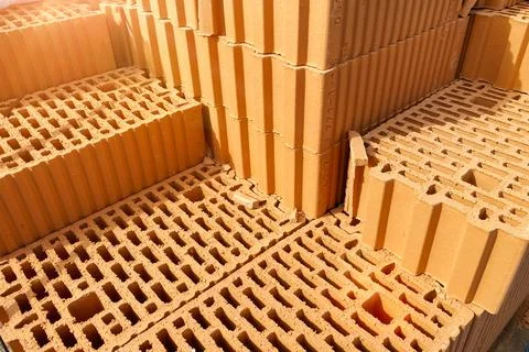 A stack of bricks made of red light clay. Environmentally friendly building m 스톡 사진