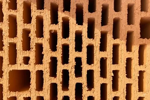 A stack of bricks made of red light clay. Environmentally friendly building m Stock Photos