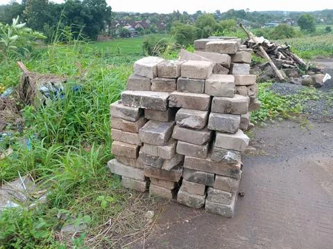 Stack of Bricks on Rural Roadside 스톡 사진