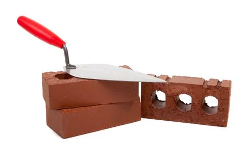 Stack bricks with trowel on a white background Stock Photos