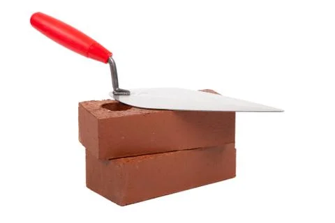 Stack bricks with trowel on a white background Stock Photos