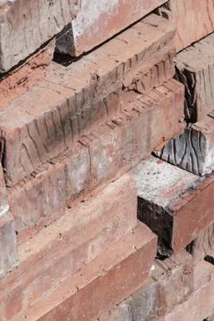 Stack of bricks vertical background building old dirty design base close up Stock Photos