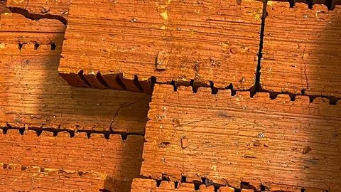 A stack of bricks with a wooden frame Stock Photos