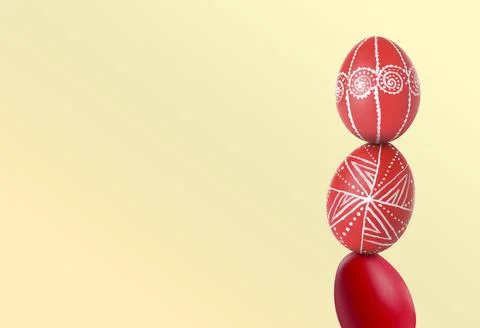 Stack of bright Easter eggs on beige background, space for text Stock Photos