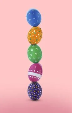 Stack of bright Easter eggs on pink gradient background Stock Photos