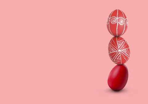 Stack of bright Easter eggs on pink background, space for text Stock Photos