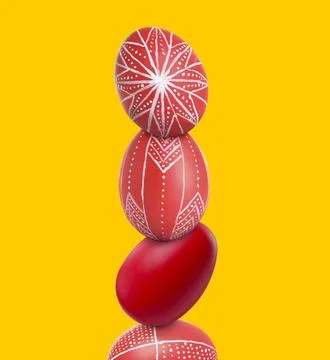 Stack of bright Easter eggs on yellow background 库存照片