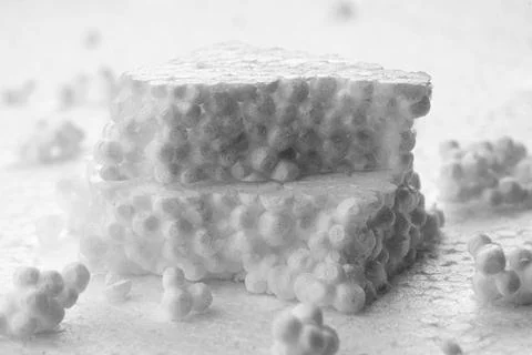 Stack of broken pieces of white styrofoam on the sheet of white styrofoam Foto stock