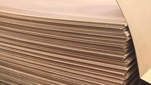 A stack of brown cardboard boxes. The boxes are stacked on top of each other  Stock Photos