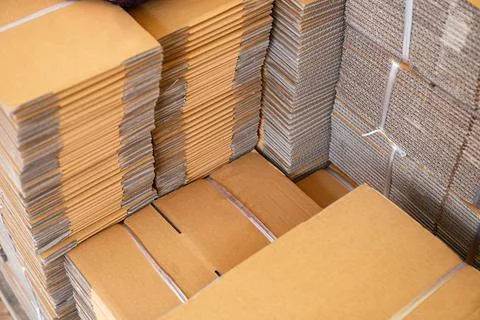 Stack of brown folded cardboard boxes tied Foto stock