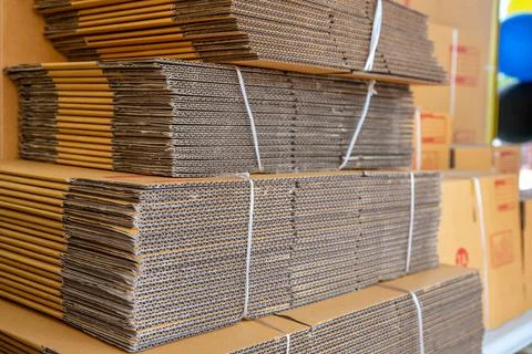 Stack of brown folded cardboard boxes tied Foto stock