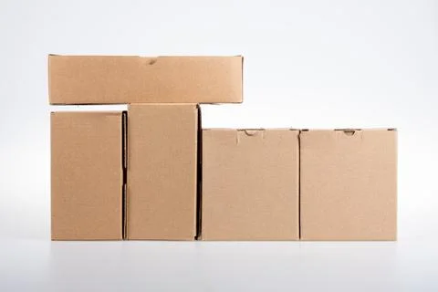 Stack of brown line cardboard boxes on white background Stock Photos