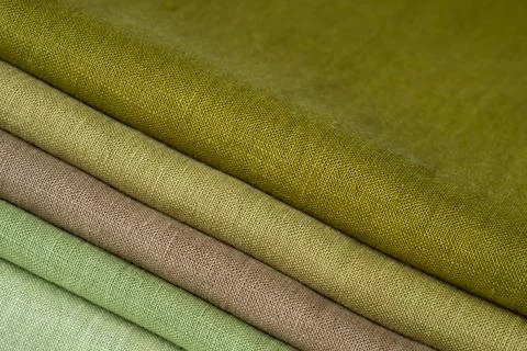 Stack of brown linen fabrics, close up Stock Photos