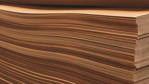 A stack of brown paper Cardboard with a wavy texture Foto stock