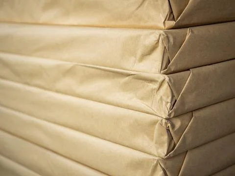 Stack of brown paper packaging. Side of corner of wrapping packaging. Foto stock