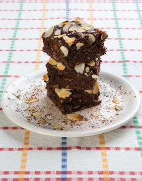 Stack of brownies on white plate Stock Photos