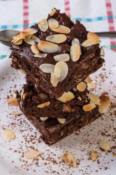 Stack of brownies on white plate Stock Photos