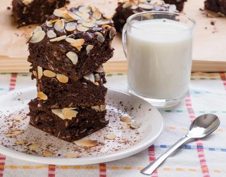 Stack of brownies on white plate Foto stock