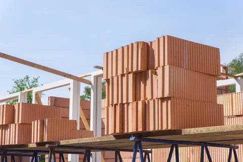 Stack of building bricks on construction site Fotos de archivo