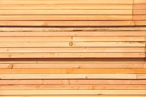 Stack of Building Lumber at Construction Site. Stock Photos