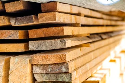 Stack of building lumber at construction site with narrow depth of field. Tim Fotos de archivo