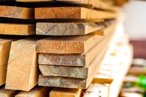 Stack of building lumber at construction site with narrow depth of field. Tim Fotos de archivo