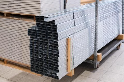 Stack of Building Material Aluminum Profile For Drywall At The Construction.. Stock Photos