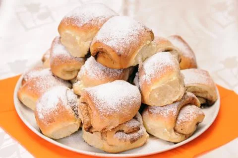 A stack of buns on a white plate Stock Photos